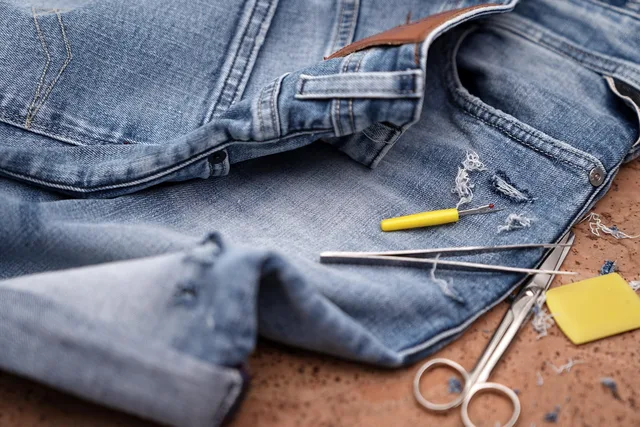 jeans, pants, repair, sew, patch, denim, shorts, fashion, clothcraft, craft, closeup, patch, denim, denim, denim, denim, denim. What to add to a general mending kit for denim repair: needles, thread, awl and thimble