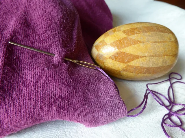 handwork, stuff, repair, darning egg, needle, thread, stockings, pantyhose, hole, mend, egg, darning yarn, wood, wooden egg, sew, darning egg, thread, mend, mend, mend, mend, mend. Creative mending in a small space: a shelf, not a spare room