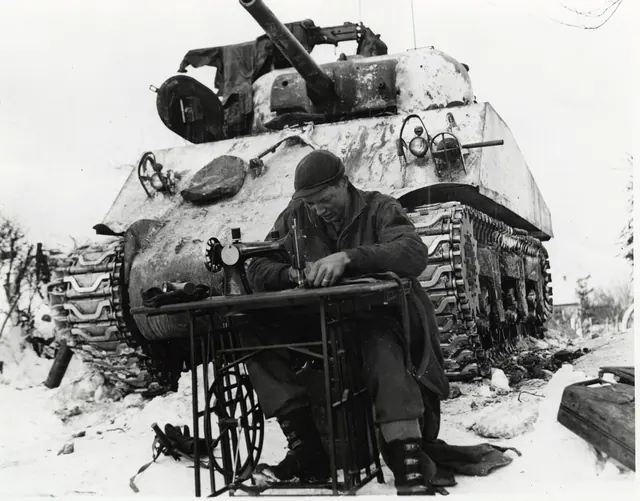 This is a photograph of Sgt. William Phelps of San Antonio, Texas, a tanker of the 42nd Tank Battalion, mending his combat clothes in Steinbach, Belgium. He uses a sewing machine i. Which new services can a small repair studio add without new equipment?