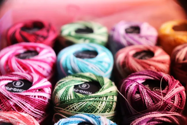 embroidery thread, colorful yarn, crochet, knitting, craft supplies, handmade, needlework, textile art, vibrant colors, yarn balls, sewing, embroidery, thread spools, hobby, diy crafts, home crafts, textile threads, fiber arts, colorful threads, yarn closeup, craft materials, wool, cotton thread, multicolor yarn, creative tools. Mending supply labels: what fiber rules require, and what they leave out