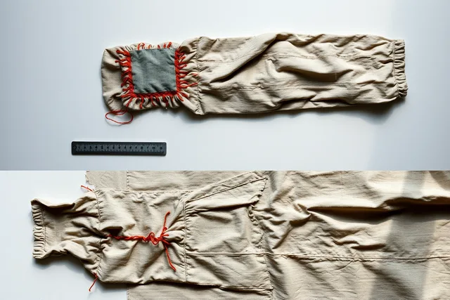 Worn garment with hand-stitched patch, puckered fabric and ruler for scale. 4 parts of visible mending mistakes, explained